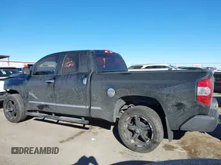 2014 Toyota Tundra 4WD Truck SR with VIN 5TFUM5F17EX051674, listed as a IAAI auction lot 41296906 with 140,782 mi miles. Bid and sale history available at carsss.com. Image 14.
