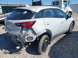 2018 Mazda CX-3 Touring z VIN JM1DKFC77J0331828, wystawiony jako IAAI lot #40482555 z przebiegiem 101 473 mil mil oraz . Historia ofert i sprzedaży dostępna na DreamBid. Obrazek 4.