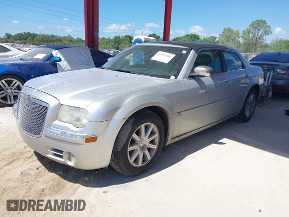 2005 Chrysler 300 with VIN 2C3AA63HX5H125777, listed as a IAAI auction lot 41843281 with 115,034 mi miles. Bid and sale history available at carsss.com. Image 2.