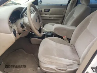 2004 Ford Taurus z VIN 1FAFP52214A194125, wystawiony jako Copart lot #43234295 z przebiegiem 216 877 mil mil oraz Szkody całkowita. Historia ofert i sprzedaży dostępna na DreamBid. Obrazek 7.