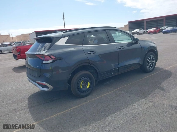 2023 Kia Sportage Hybrid EX with VIN KNDPVCAG5P7020209, listed as a IAAI auction lot 41409698 with 67,953 mi miles. Bid and sale history available at carsss.com. Image 4.