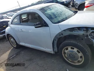 2014 Volkswagen Beetle 2.5L w/Sun with VIN 3VWJP7ATXEM628666, listed as a IAAI auction lot 41328014 with 70,990 mi miles and . Bid and sale history available at DreamBid. Image 14.