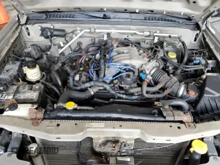 2004 Nissan Frontier XE z VIN 1N6ED29Y64C419454, wystawiony jako Copart lot #56629355 z przebiegiem 214 296 mil mil oraz Szkoda całkowita • Salvage title. Historia ofert i sprzedaży dostępna na DreamBid. Obrazek 11.