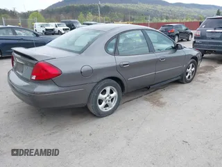 2003 Ford Taurus SES Standard with VIN 1FAFP55S63G176291, listed as a IAAI auction lot 42079514 with 173,623 mi miles. Bid and sale history available at carsss.com. Image 4.