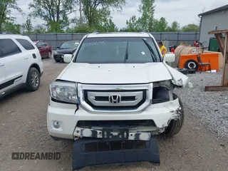2011 Honda Pilot Touring z VIN 5FNYF4H96BB106873, wystawiony jako IAAI lot #42154795 z przebiegiem 162 282 mil mil oraz . Historia ofert i sprzedaży dostępna na DreamBid. Obrazek 12.