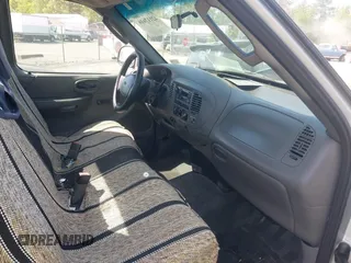 2002 Ford F-150 XL with VIN 1FTRF17202NB42616, listed as a IAAI auction lot 42117616 with 230,852 mi miles. Bid and sale history available at carsss.com. Image 5.
