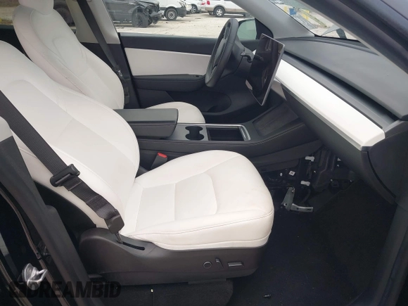 2021 Tesla Model Y Standard Range with VIN 5YJYGDED8MF123246, listed as a IAAI auction lot 41291676 with 74,630 mi miles and . Bid and sale history available at DreamBid. Image 5.