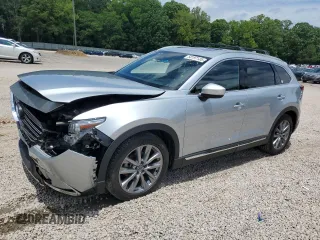 2021 Mazda CX-9 Grand Touring z VIN JM3TCBDY2M0527406, wystawiony jako Copart lot #58197135 z przebiegiem 102 515 mil mil oraz Szkoda całkowita • Salvage title. Historia ofert i sprzedaży dostępna na DreamBid. Obrazek 1.