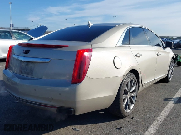 2013 Cadillac XTS Luxury z VIN 2G61R5S31D9185009, wystawiony jako IAAI lot #41243001 z przebiegiem 161 219 mil mil oraz . Historia ofert i sprzedaży dostępna na DreamBid. Obrazek 4.