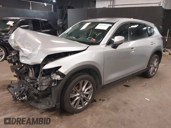 2021 Mazda CX-5 Grand Touring with VIN JM3KFBDM7M1392644, listed as a IAAI auction lot 41824612 with 80,000 mi miles and . Bid and sale history available at DreamBid. Image 16.