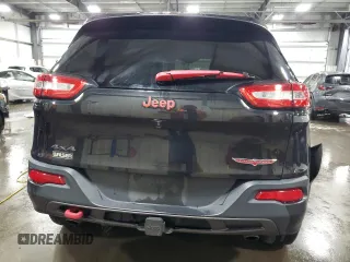 2015 Jeep Cherokee Trailhawk with VIN 1C4PJMBS5FW587545, listed as a Copart auction lot 58820685 with 136,755 mi miles and Salvage title. Bid and sale history available at DreamBid. Image 6.