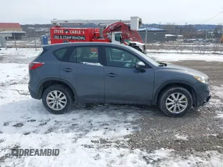 2013 Mazda CX-5 Sport z VIN JM3KE2BE9D0156274, wystawiony jako IAAI lot #41624466 z przebiegiem 159 017 mil mil oraz . Historia ofert i sprzedaży dostępna na DreamBid. Obrazek 13.