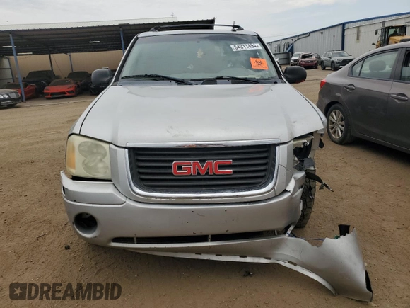 2005 GMC Envoy SLT with VIN 1GKDT13S152124404, listed as a Copart auction lot 64011494 with 212,951 mi miles and Salvage Title. Bid and sale history available at DreamBid. Image 5.