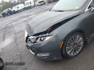 2015 Lincoln MKZ Hybrid z VIN 3LN6L2LU7FR618867, wystawiony jako IAAI lot #42291650 z przebiegiem 109 021 mil mil oraz . Historia ofert i sprzedaży dostępna na DreamBid. Obrazek 6.