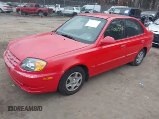 2005 Hyundai Accent GLS with VIN KMHCG45CX5U614083, listed as a IAAI auction lot 41006582 with 72,516 mi miles. Bid and sale history available at carsss.com. Image 17.