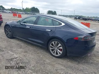 2014 Tesla Model S 60 z VIN 5YJSA1H17EFP33860, wystawiony jako IAAI lot #42471432 z przebiegiem 142 045 mil mil oraz . Historia ofert i sprzedaży dostępna na DreamBid. Obrazek 3.