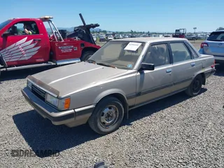 1986 Toyota Camry z VIN JT2SV16E1G0439200, wystawiony jako IAAI lot #42395141 z przebiegiem 159 698 mil mil oraz . Historia ofert i sprzedaży dostępna na DreamBid. Obrazek 2.