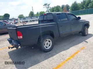2004 Dodge Dakota SLT z VIN 1D7HG48N34S693877, wystawiony jako IAAI lot #42423197 z przebiegiem 163 141 mil mil oraz . Historia ofert i sprzedaży dostępna na DreamBid. Obrazek 4.