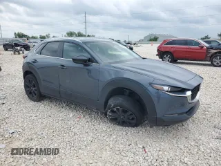 2023 Mazda CX-30 S Carbon Edition z VIN 3MVDMBCM2PM539130, wystawiony jako Copart lot #54817735 z przebiegiem 29 678 mil mil oraz Szkoda całkowita • Salvage title. Historia ofert i sprzedaży dostępna na DreamBid. Obrazek 4.