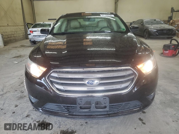 2014 Ford Taurus SEL z VIN 1FAHP2E80EG128686, wystawiony jako Copart lot #57158255 z przebiegiem 69 529 mil mil oraz Szkoda całkowita • Salvage title. Historia ofert i sprzedaży dostępna na DreamBid. Obrazek 5.