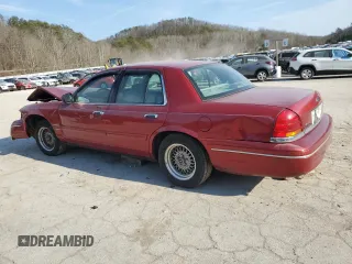 2001 Ford Crown Victoria LX z VIN 2FAFP74W41X205147, wystawiony jako Copart lot #46240035 z przebiegiem 65 495 mil mil oraz Szkoda całkowita • Salvage title. Historia ofert i sprzedaży dostępna na DreamBid. Obrazek 2.