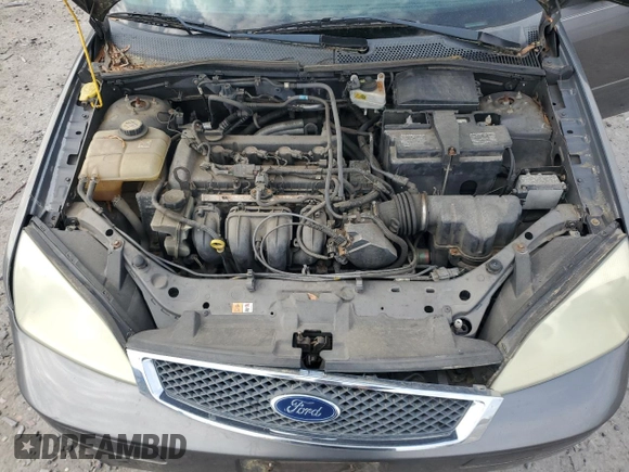 2007 Ford Focus S z VIN 1FAFP34N67W111209, wystawiony jako Copart lot #52708405 z przebiegiem 100 538 mil mil oraz Czysty tytuł • Clean title. Historia ofert i sprzedaży dostępna na DreamBid. Obrazek 11.