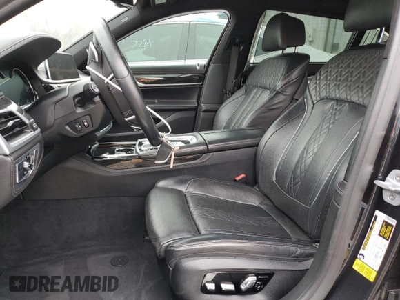 2019 BMW 7 Series 750i with VIN WBA7F0C54KGM25281, listed as a Copart auction lot 84741334 with 76,472 mi miles and Salvage Title. Bid and sale history available at carsss.com. Image 7.