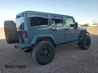 2014 Jeep Wrangler Unlimited Rubicon with VIN 1C4HJWFG9EL199501, listed as a Copart auction lot 61443595 with 86,940 mi miles and Salvage title. Bid and sale history available at DreamBid. Image 3.