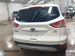 2014 Ford Escape SE with VIN 1FMCU9G99EUC15477, listed as a IAAI auction lot 42147162 with 98,886 mi miles and . Bid and sale history available at DreamBid. Image 16.