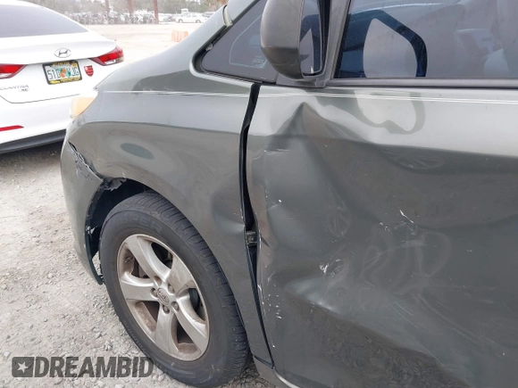 2014 Toyota Sienna L with VIN 5TDZK3DC6ES421278, listed as a IAAI auction lot 41178679 with 202,823 mi miles. Bid and sale history available at carsss.com. Image 18.