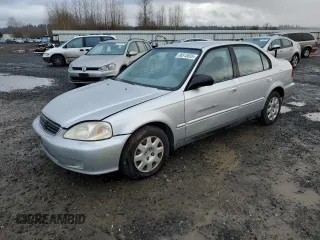 1999 Honda Civic VP z VIN 2HGEJ6616XH539865, wystawiony jako Copart lot #88510835 z przebiegiem 309 615 mil mil oraz Czysty tytuł • Clean title. Historia ofert i sprzedaży dostępna na DreamBid. Obrazek 1.