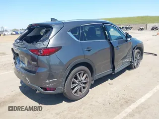 2017 Mazda CX-5 Grand Touring with VIN JM3KFADL6H0217850, listed as a IAAI auction lot 42033404 with 74,198 mi miles and . Bid and sale history available at carsss.com. Image 4.