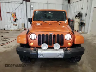 2011 Jeep Wrangler Sahara with VIN 1J4GA5D1XBL557392, listed as a Copart auction lot 56892835 with 109,567 mi miles and Clean title. Bid and sale history available at DreamBid. Image 5.