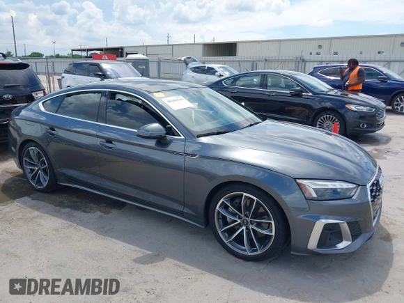 2022 Audi A5 Sportback S line Premium Plus z VIN WAUFACF5XNA009427, wystawiony jako IAAI lot #40203616 z przebiegiem 54 005 mil mil oraz . Historia ofert i sprzedaży dostępna na DreamBid. Obrazek 13.