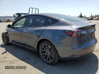 2023 Tesla Model 3 with VIN 5YJ3E1EA4PF615975, listed as a Copart auction lot 58845405 with 38,927 mi miles and Salvage title. Bid and sale history available at DreamBid. Image 2.