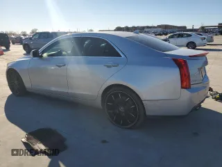 2013 Cadillac ATS Performance z VIN 1G6AC5S3XD0120025, wystawiony jako Copart lot #84156584 z przebiegiem 124 592 mil mil oraz Szkody całkowita. Historia ofert i sprzedaży dostępna na DreamBid. Obrazek 2.