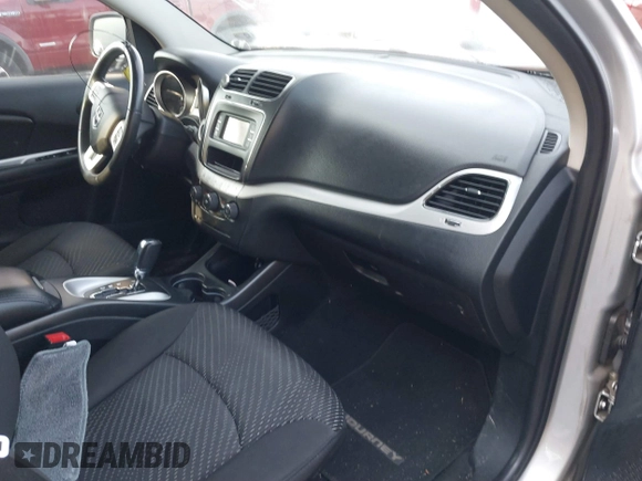 2014 Dodge Journey SE with VIN 3C4PDCAB1ET247218, listed as a IAAI auction lot 41760408 with 148,591 mi miles and . Bid and sale history available at carsss.com. Image 5.