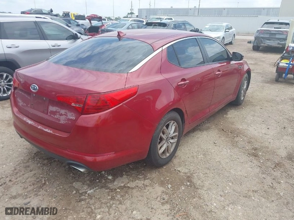 2011 Kia Optima LX with VIN KNAGM4A79B5057807, listed as a IAAI auction lot 42086984 with 133,261 mi miles. Bid and sale history available at carsss.com. Image 4.