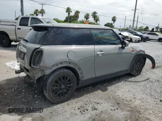 2014 MINI Hardtop with VIN WMWXM5C51ET934047, listed as a Copart auction lot 63039335 with 104,446 mi miles and Salvage title. Bid and sale history available at DreamBid. Image 3.