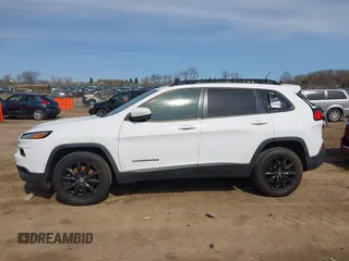 2014 Jeep Cherokee Latitude with VIN 1C4PJMCB1EW301011, listed as a IAAI auction lot 41777745 with 133,643 mi miles and . Bid and sale history available at DreamBid. Image 14.