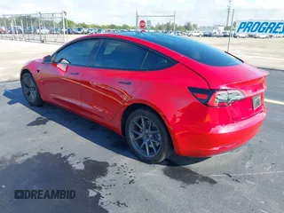 2023 Tesla Model 3 with VIN 5YJ3E1EA2PF588467, listed as a IAAI auction lot 42254921 with 11,217 mi miles and . Bid and sale history available at DreamBid. Image 3.