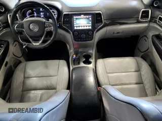 2017 Jeep Grand Cherokee Summit with VIN 1C4RJFJT4HC723876, listed as a Copart auction lot 52647205 with 97,412 mi miles and Salvage title. Bid and sale history available at DreamBid. Image 8.