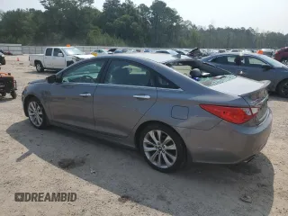 2013 Hyundai Sonata SE z VIN 5NPEC4AC2DH557370, wystawiony jako Copart lot #59120895 z przebiegiem 180 932 mil mil oraz Szkoda całkowita • Salvage title. Historia ofert i sprzedaży dostępna na DreamBid. Obrazek 2.
