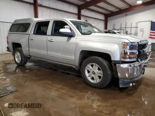 2017 Chevrolet Silverado 1500 LT with VIN 3GCUKREC3HG320455, listed as a Copart auction lot 43765005 with 119,683 mi miles and Salvage Title. Bid and sale history available at DreamBid. Image 4.