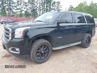 2015 GMC Yukon SLT with VIN 1GKS1BKC5FR274408, listed as a IAAI auction lot 41942157 with 165,978 mi miles. Bid and sale history available at carsss.com. Image 2.