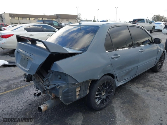 2004 Mitsubishi Lancer ES with VIN JA3AJ26E54U054570, listed as a IAAI auction lot 41592397 with 220,140 mi miles. Bid and sale history available at carsss.com. Image 4.