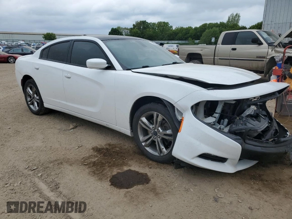 2015 Dodge Charger SXT with VIN 2C3CDXJG7FH779296, listed as a Copart auction lot 58490215 with 173,371 mi miles and Clean title. Bid and sale history available at DreamBid. Image 4.