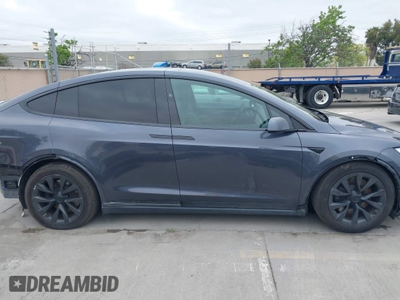 2022 Tesla Model X Plaid with VIN 7SAXCBE6XNF337687, listed as a IAAI auction lot 42035097 with 18,756 mi miles and . Bid and sale history available at DreamBid. Image 14.