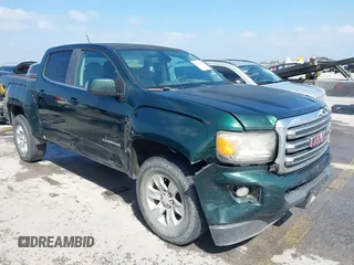 2015 GMC Canyon 2WD SLE z VIN 1GTG5BE37F1235352, wystawiony jako IAAI lot #42167761 z przebiegiem 150 789 mil mil oraz . Historia ofert i sprzedaży dostępna na DreamBid. Obrazek 1.