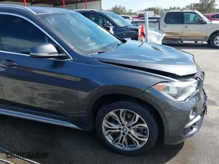2017 BMW X1 xDrive28i with VIN WBXHT3Z33H4A65198, listed as a IAAI auction lot 41798503 with 88,951 mi miles. Bid and sale history available at carsss.com. Image 18.